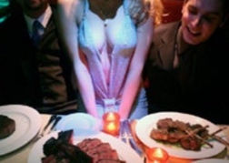 Stripper sat at a dinner table