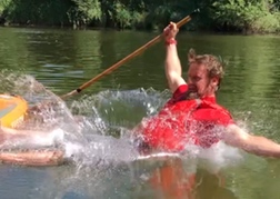 Someone falling off paddle board