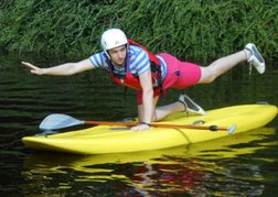 Man on SUPing Board on one hand