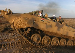 Tank Driving up a muddy hill