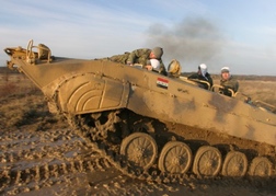Tank Driving up a muddy hill in Budapest