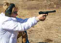 Lady from a hen party hand gun shooting 