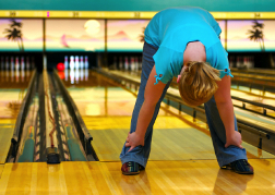 Lady playing Ten Pin Bowling from a hen party