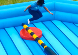 Total Wipeout Inflatable with a man jumping