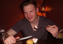 man from a stag party eating a pudding
