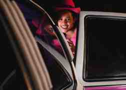 Lady Climbing Out Of A Car