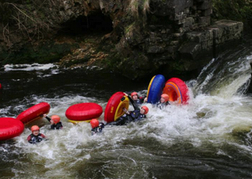 a stag party wiping out White Water Tubing