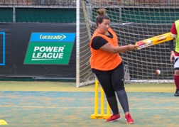 A girl from a hen party hitting the ball