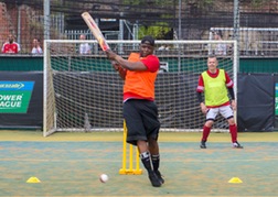 A man hits the ball in Turbo Cricket