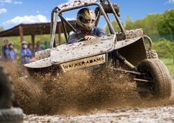 A man from a stag party racing A WA Rebel Dirt Buggy