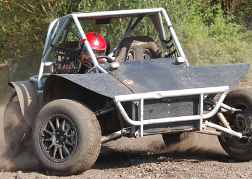 A man from a stag party racing A WA Rebel Buggy Birmingham