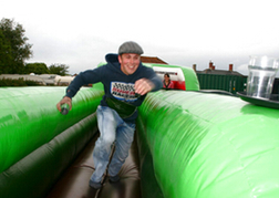 man running in the West Country Games experience on his stag weekend 