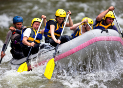 stag party White water rafting hitting frothing water