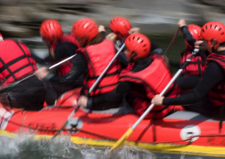 group White water rafting paddling