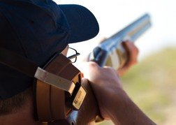 Clay Pigeon Shooting close up, looking down a barrel of a gun