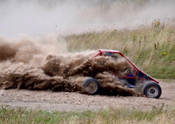 A rage buggy kicking up loads of dust
